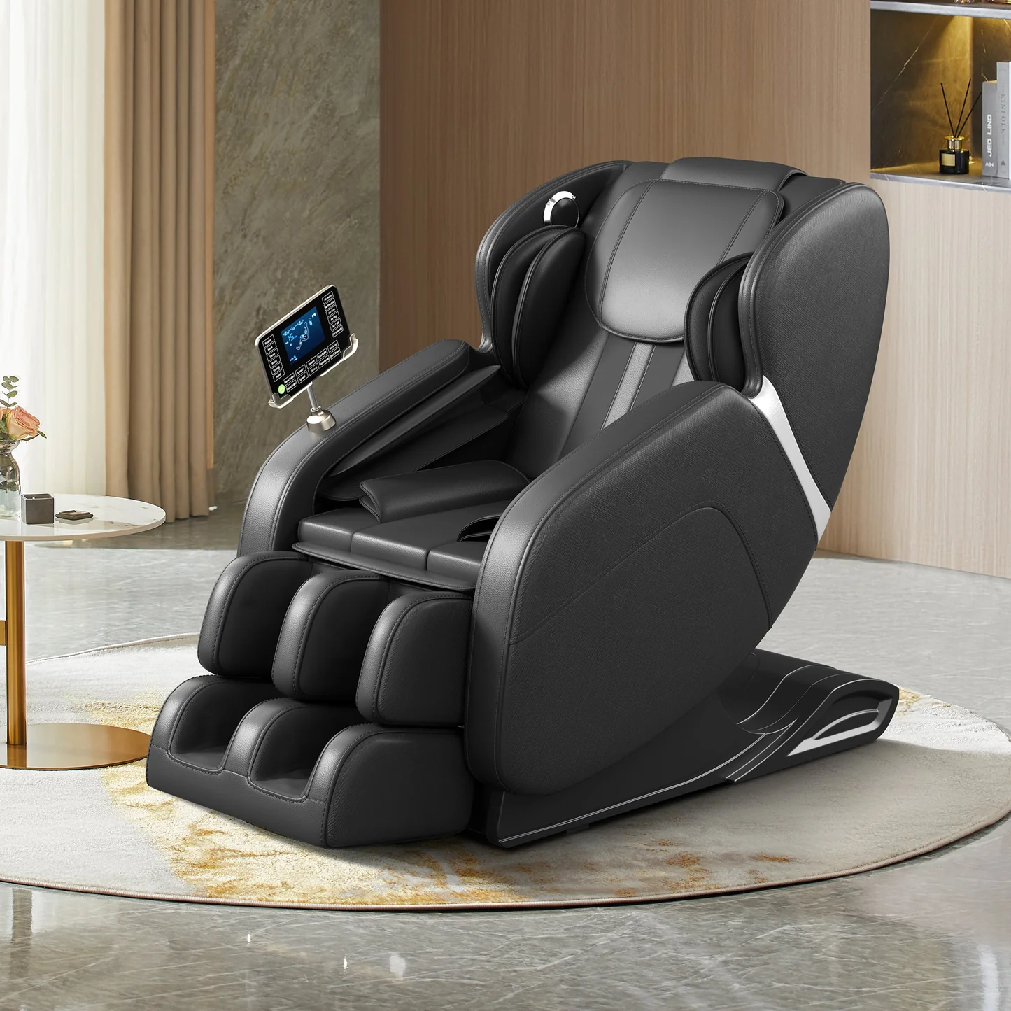 A sleek, modern black massage chair is prominently displayed on a circular rug in a well-lit, contemporary room. The chair features a touch screen control panel mounted on its armrest, displaying various massage functions and diagrams. Decorative elements like a small table with a vase of flowers and a shelf with books and a diffuser are visible in the background, suggesting a home or spa-like setting. The chair's design includes plush padding, integrated foot massagers, and metallic accents, emphasizing comfort and advanced technology.