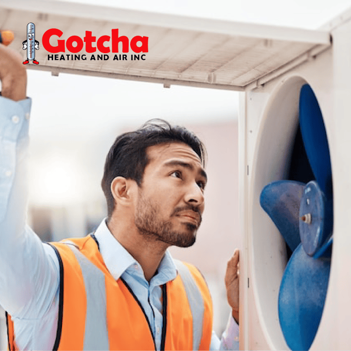 HVAC technician inspecting air conditioning unit for repair and maintenance by Gotcha Heating and Air Inc