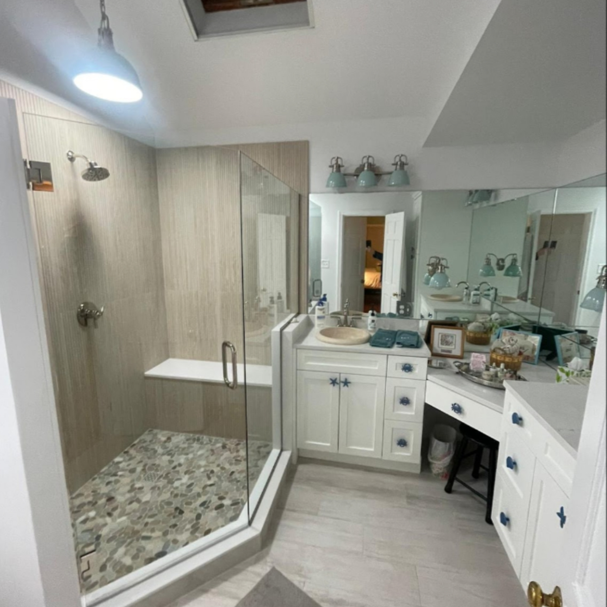 Elegant bathroom with a spacious walk-in shower, a double vanity, and a sleek, modern design. A luxurious retreat designed for relaxation and comfort.