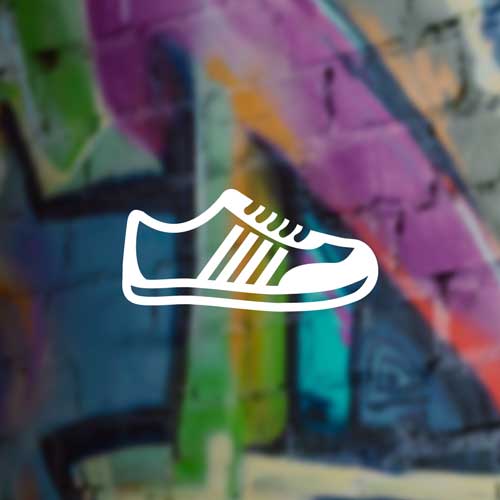 A graphic illustration of a white athletic shoe with colorful stripes on a blurred background of graffiti art.