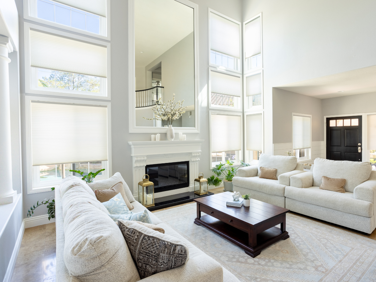 Motorized cellular shades in high, hard-to-reach windows.