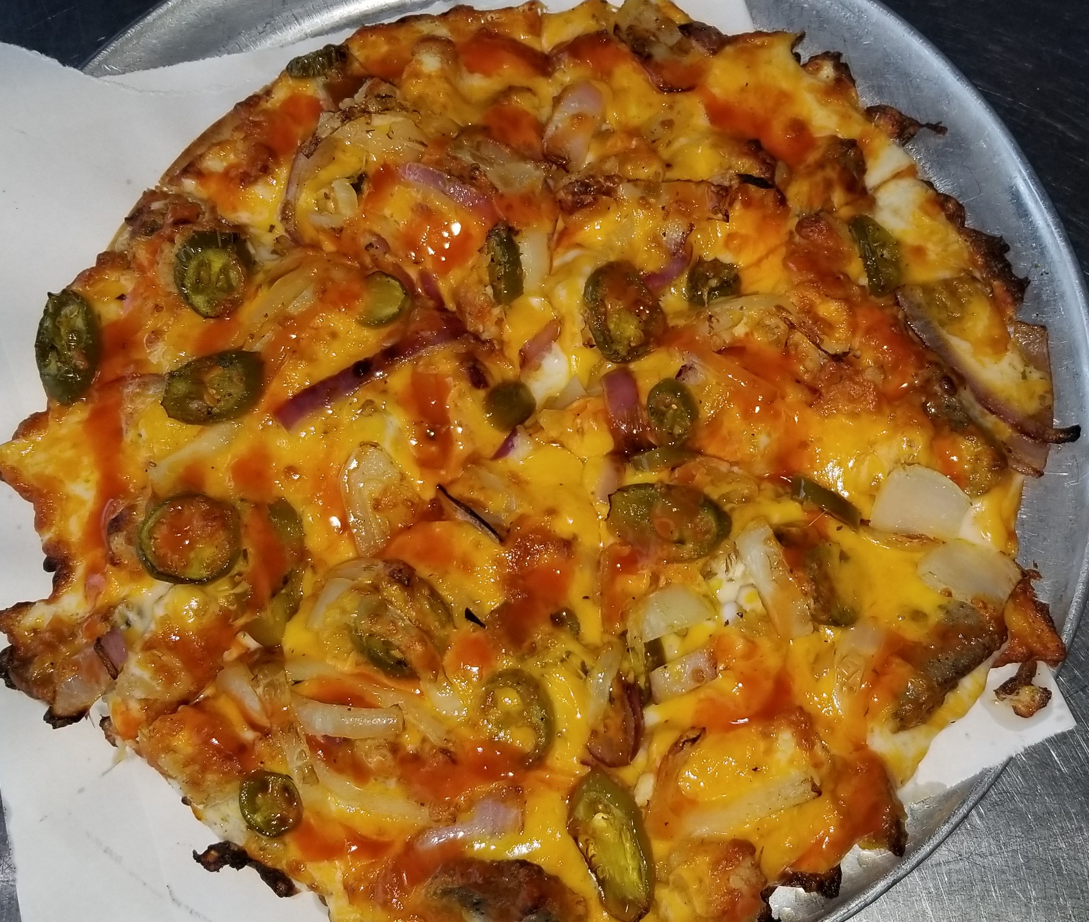 Specialty Taste of Mexico Pizza! Optional add lettuce!