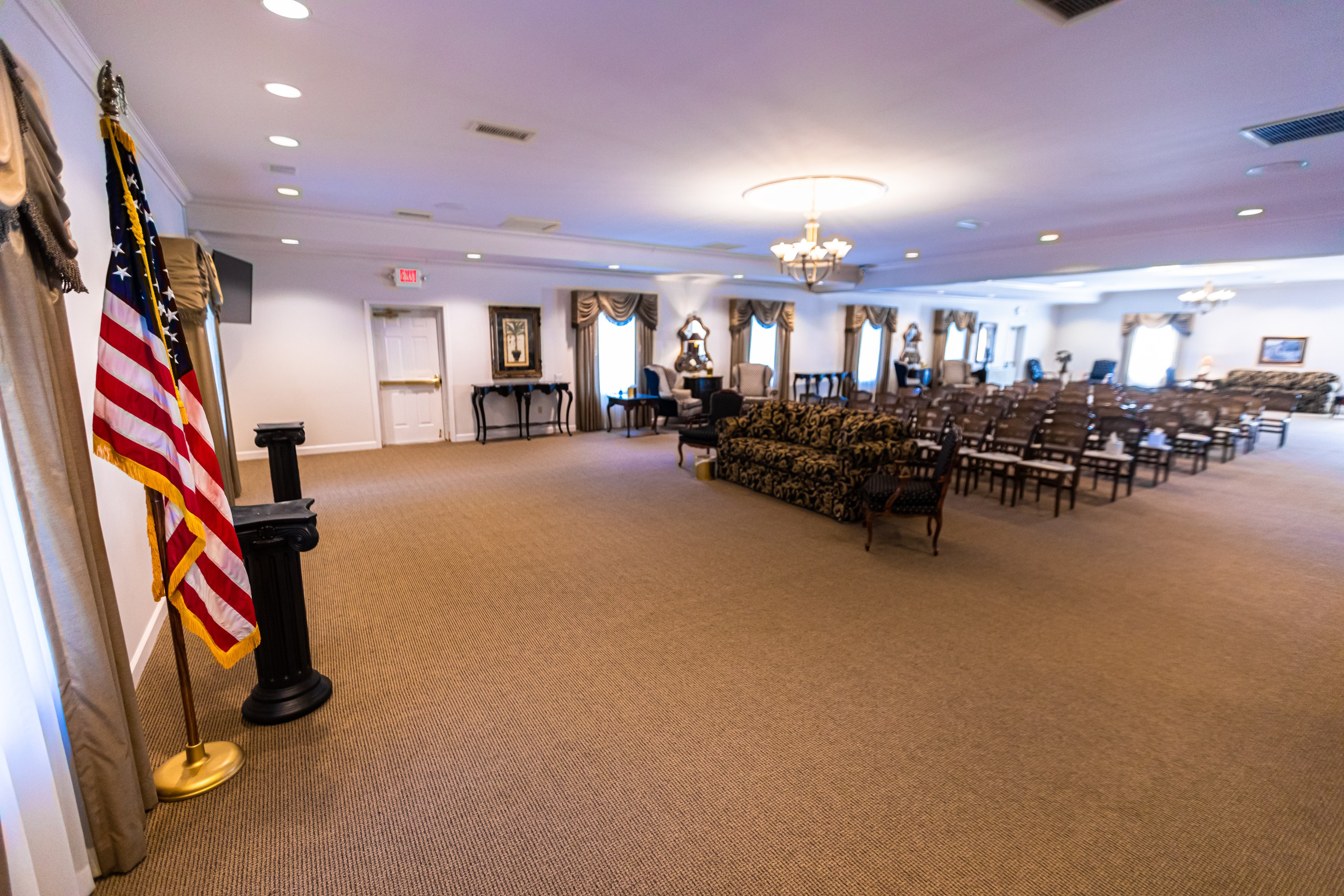 The spacious, fully accessible chapel at Sharp's Fenton Chapel, set up with a US flag