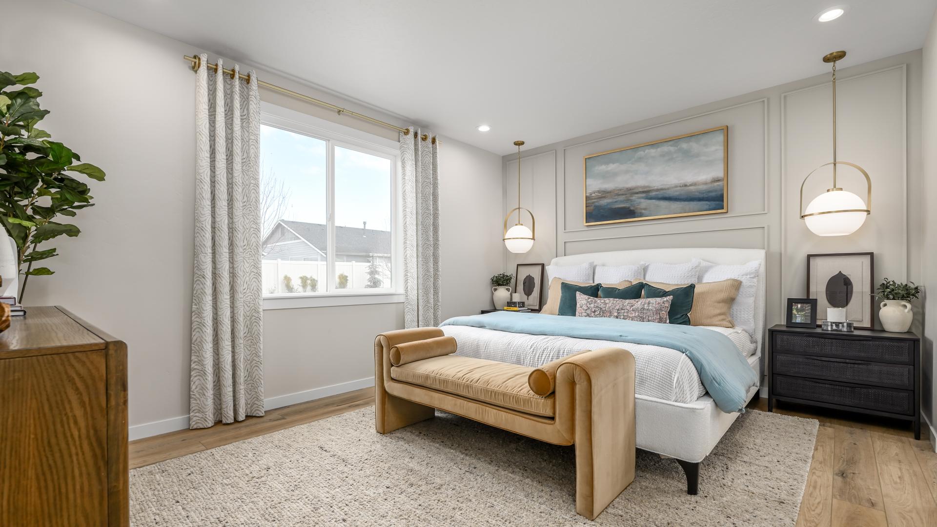Spacious primary bedroom designed for comfort and relaxation