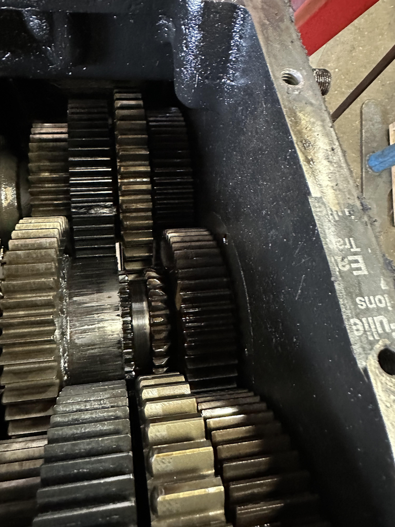 A detailed view inside a heavy-duty transmission housing reveals a complex arrangement of interlocke 