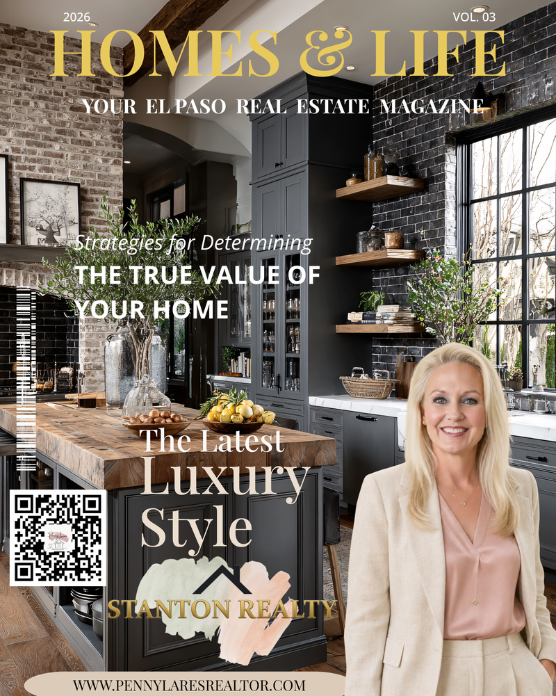 A smiling blonde woman in a beige suit stands in front of a modern kitchen, with text overlays for a real estate magazine cover. The magazine title is "HOMES & LIFE," and it features articles on "Strategies for Determining THE TRUE VALUE OF YOUR HOME" and "The Latest Luxury Style." A QR code and website address are also visible.