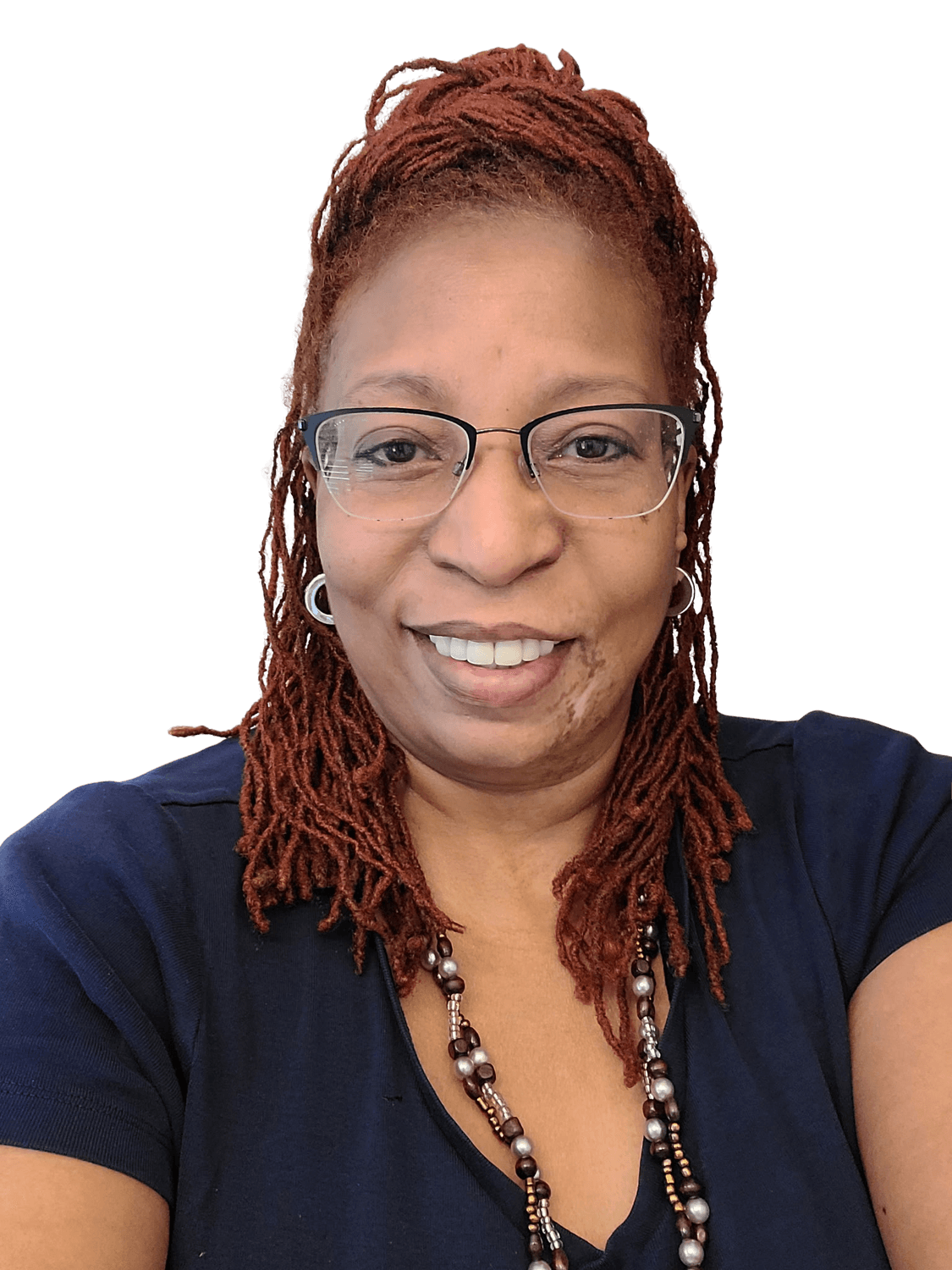 A medium shot portrait of Tracy Denise Anderson, the Founder & CEO of TD Event Space, who is smiling at the camera. She has auburn dreadlocks styled in a bun, wears glasses with black frames, and is dressed in a navy blue V-neck shirt. A beaded necklace adorns her neck. The background is a solid teal color.