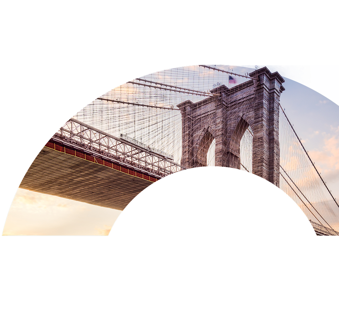 A view of the Brooklyn Bridge displayed in the curve of a large letter O.