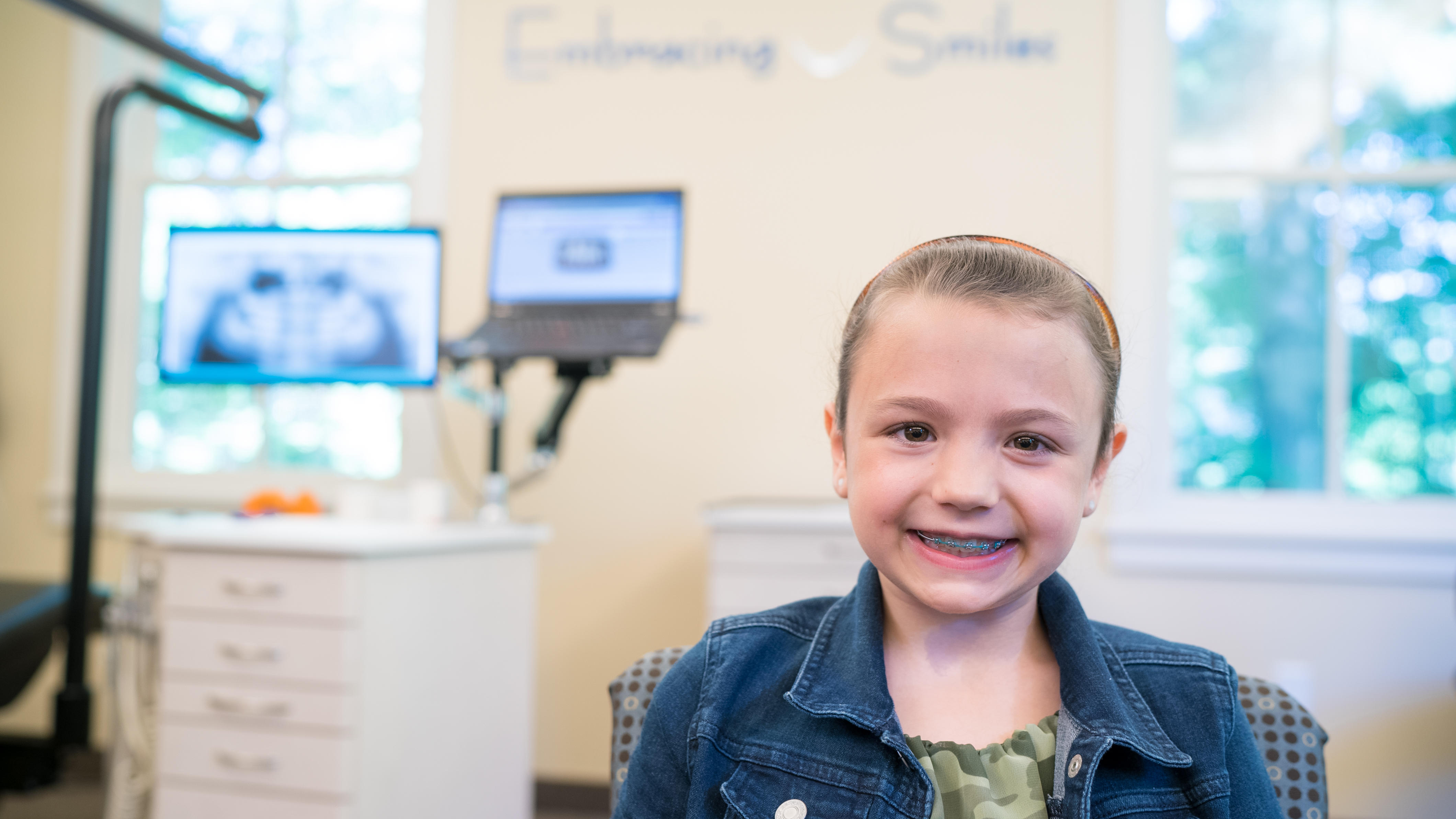 girl smiling at cooney orhthodontics office in ballston lake, ny