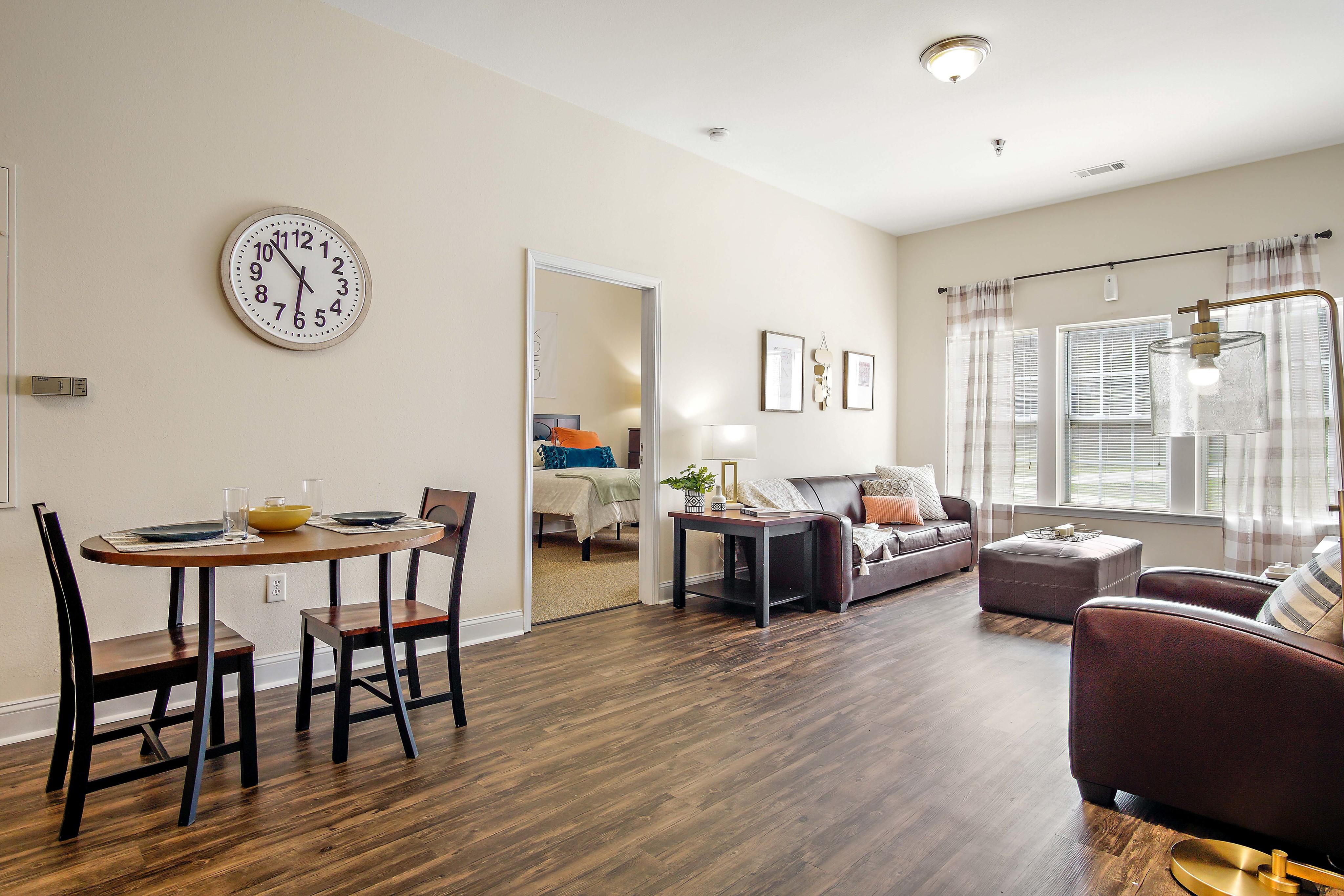 Open concept living with dining area and living room. Central House on Stadium Apartments Mobile (251)272-4710