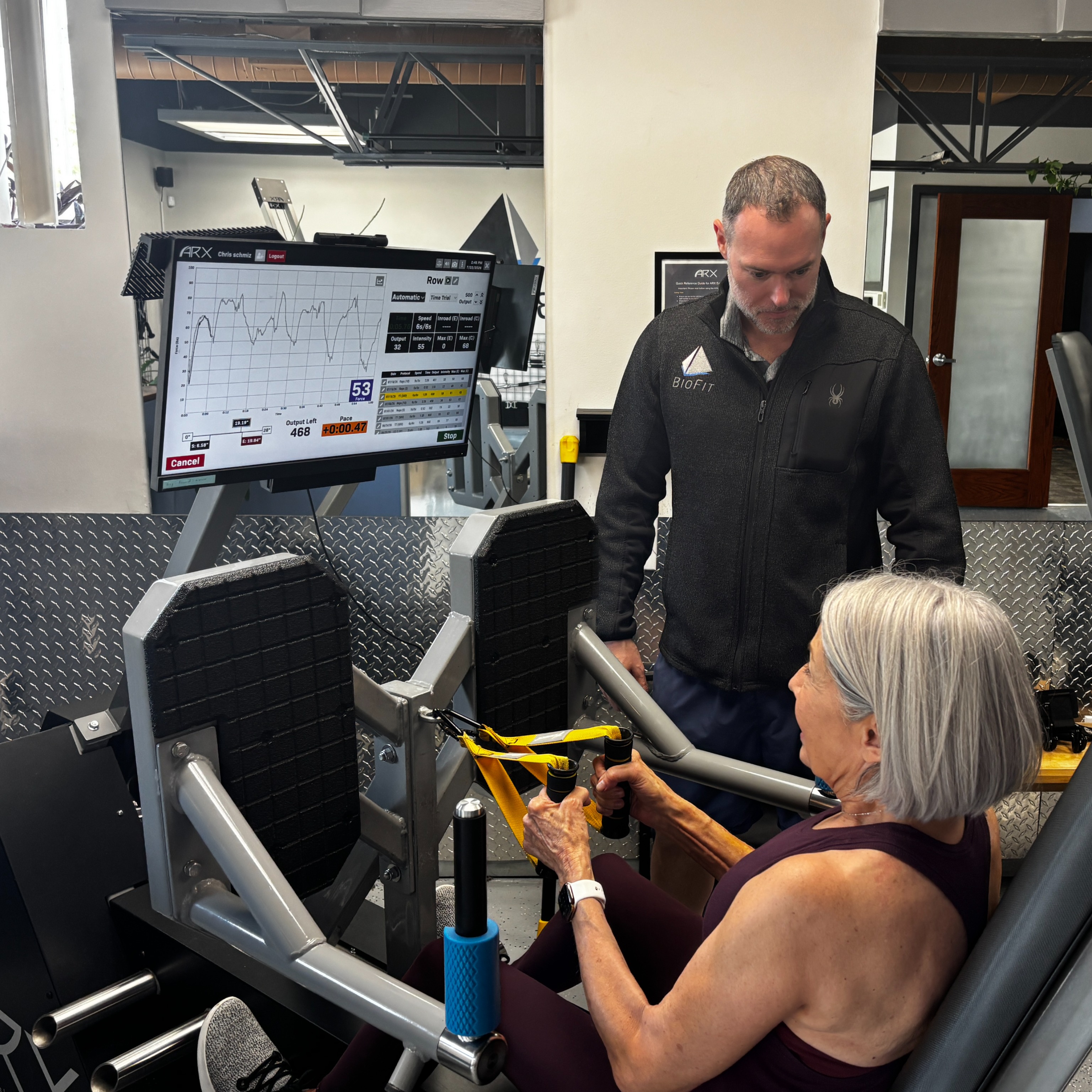 Coach-guided strength training at BioFit STL's Richmond Heights studio. Founder John Zarbock works 1 