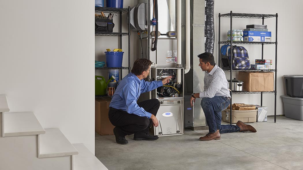 A Carrier dealer performs a furnace repair
