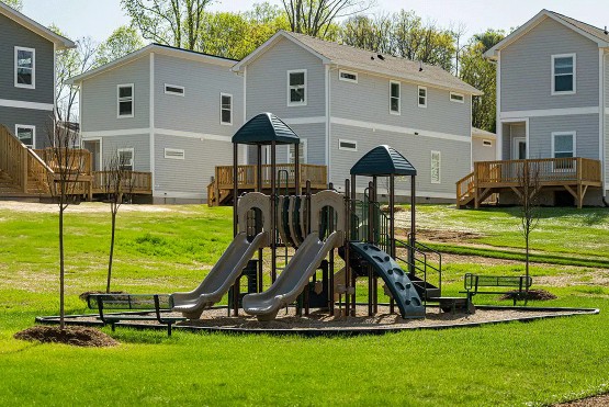 The playground at Belle Meadow Homes provides a fun and safe area for children to play.