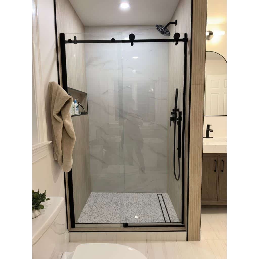 Clean lines, modern styling, and built to last. A seamless glass enclosure paired with bold matte hardware can completely redefine your bathroom's appearance. Partner with a licensed residential contractor who knows how to bring a luxury vision to life flawlessly.