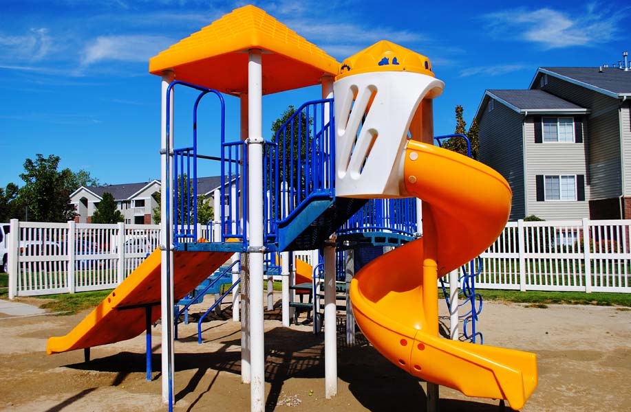 A Playground With a Yellow Slide