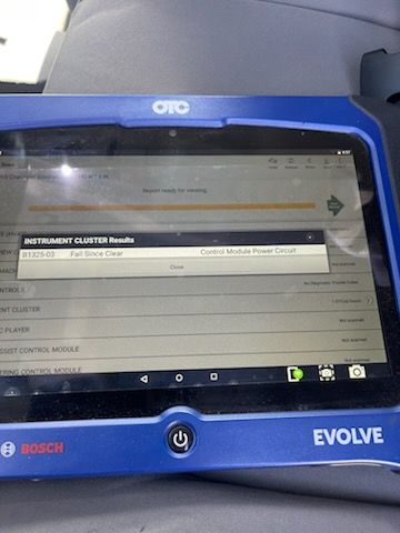 Bosch OTC Evolve diagnostic tablet displays vehicle scan results, including instrument cluster information and a control module power circuit fault, used for troubleshooting electronic systems on specialized service vehicles professionally.