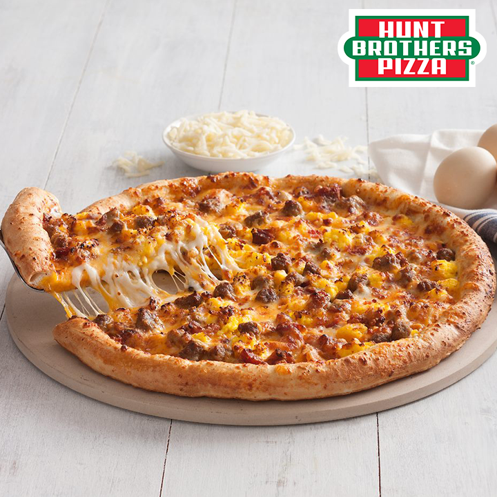Hunt Brothers® Pizza Breakfast Pizza on Original Crust. Topped with fluffy scrambled eggs, chopped bacon, breakfast sausage, and of course a blend of mozzarella and cheddar cheese, it’s all there on our buttered original crust.