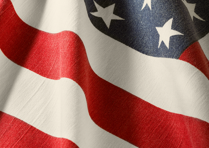 Close-up of the American flag, billowing in the wind.