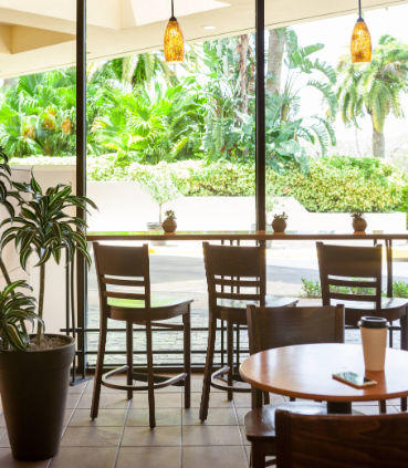 The Coffee Bean & Tea Leaf offers all-day dining and a warm atmosphere with comfortable seating.