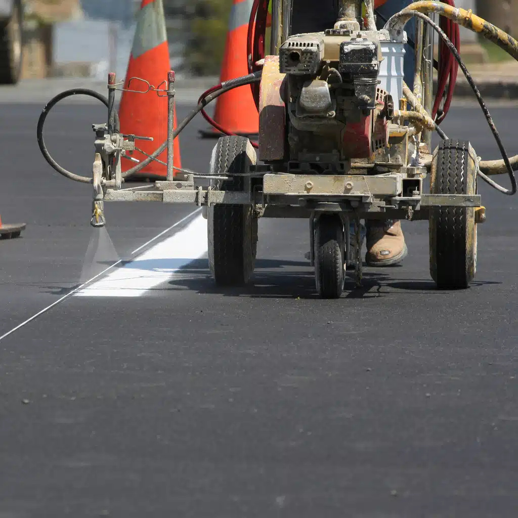 Precision pavement marking services that enhance roadway safety, traffic flow, and property organization. Using advanced line striping equipment and high-durability paint, we deliver clean, highly visible markings for roads, parking lots, and commercial spaces. Our team ensures accurate layouts, crisp lines, and long-lasting results that comply with local regulations and ADA standards. Whether you need new striping or re-striping, our solutions improve navigation, maximize space efficiency, and create a safer environment for drivers and pedestrians.