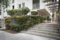 Staircase with Mission Hills Commons monument sign to the left.