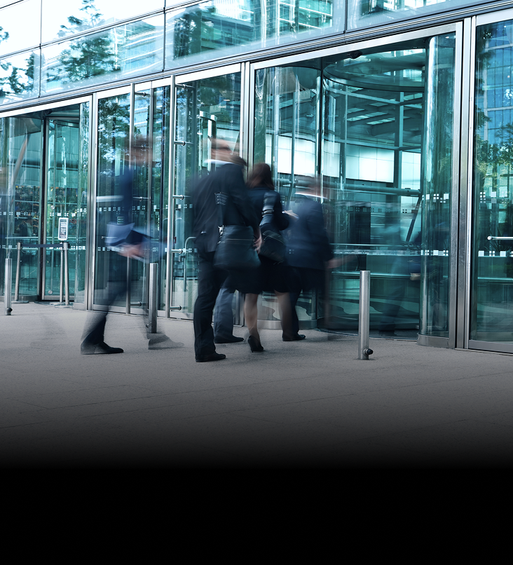 A group of professionals entering an office building.