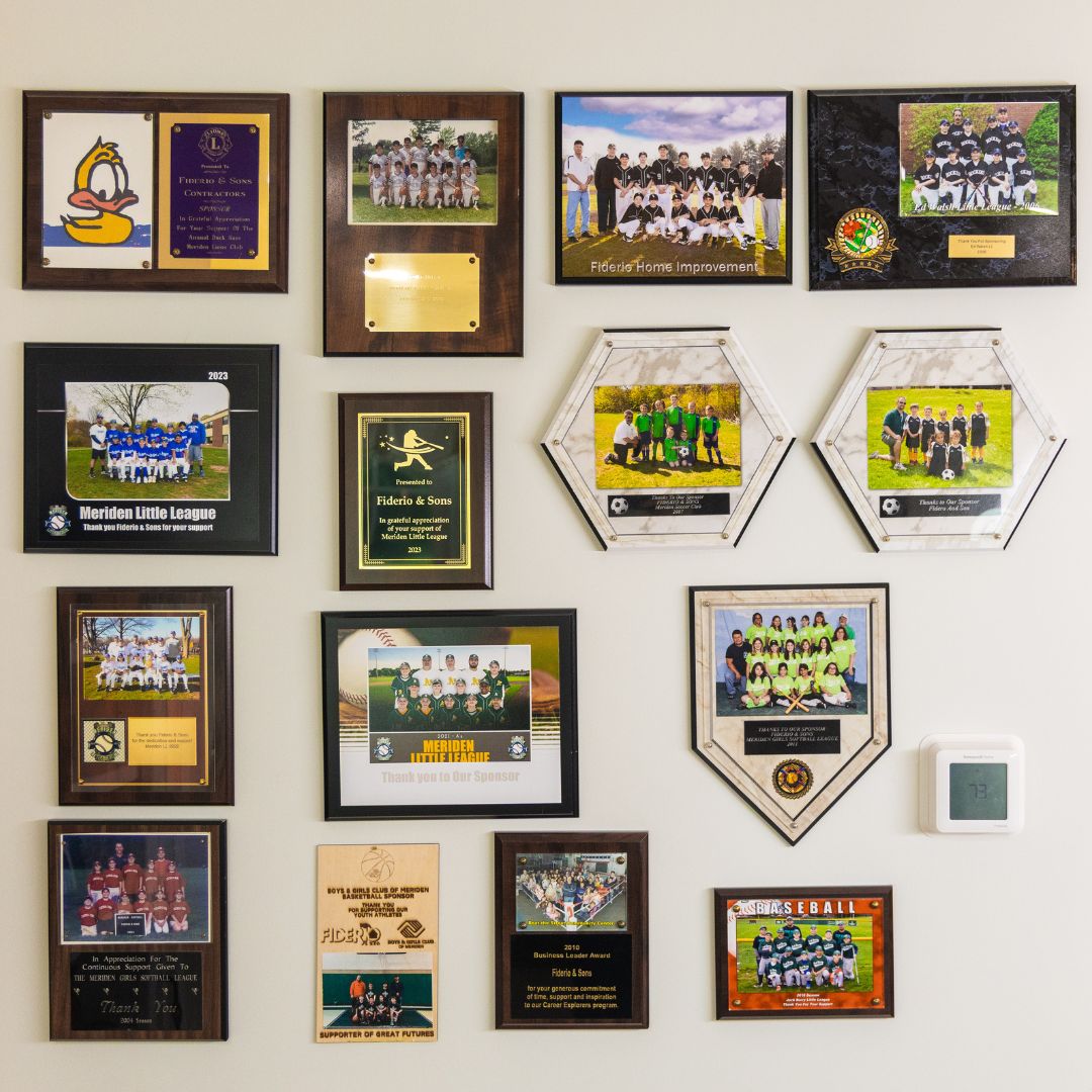 Community sponsorship and recognition wall at Fiderio & Sons headquarters.