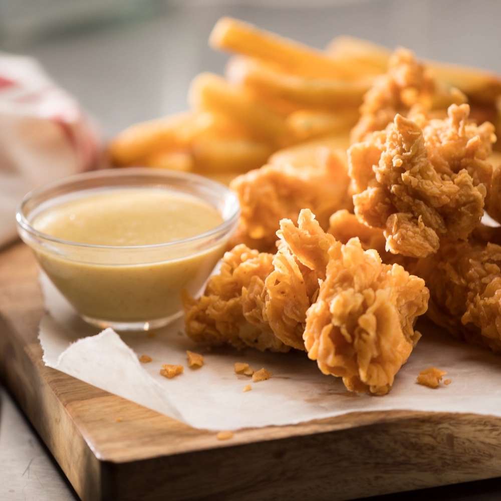 A meal fit for a champion, our hand-breaded chicken tenders are made to order. Choose from classic, Buffalo or honey hot. Served with two sides.