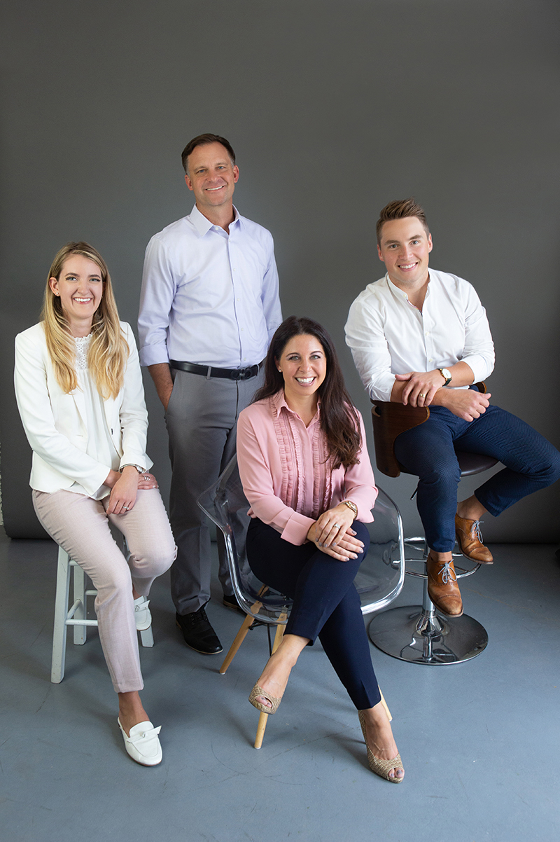 The Colorado Ear Care staff including Jacie Gregory (Operations Coordinator), Matt Wilken (Founder & Audiologist), Meredith Wilken (Founder & Audiologist), and Cory Tickle (Audiologist)