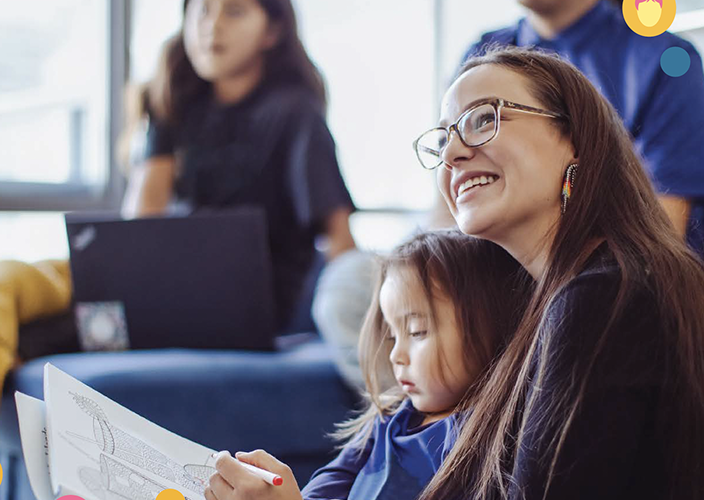 A mother and daughter colouring together.