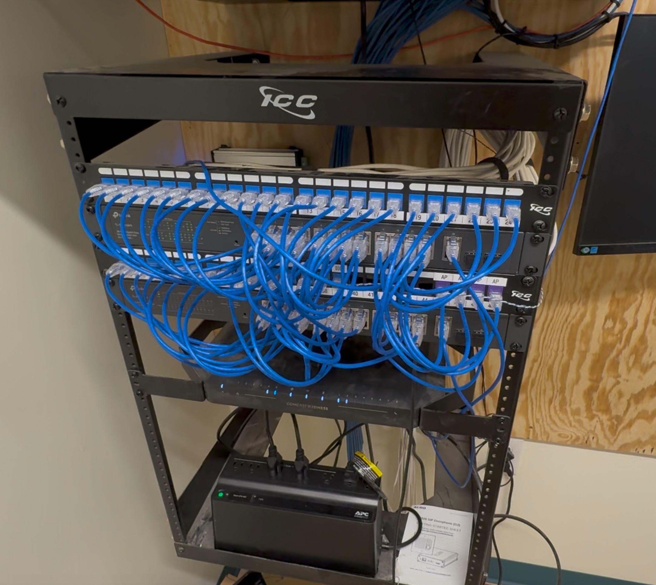 This is what the inside of a well-run network closet looks like. ICC patch panel on top, two managed switches handling all the connections, a Comcast Business gateway, and an APC battery backup at the bottom keeping everything running when the power hiccups. Every port labeled. Every cable run clean.

It matters more than most people think. When something goes wrong at 9am on a Monday, the difference between finding the problem in five minutes and finding it in two hours is whether the person who built this knew what they were doing. Messy cabling hides problems. A rat's nest of unlabeled cables means longer outages, more guesswork, and more money spent on labor that shouldn't have been necessary.

Clean infrastructure is also honest infrastructure. You can see exactly what's connected, what's not, and what changed. That's how networks should work.