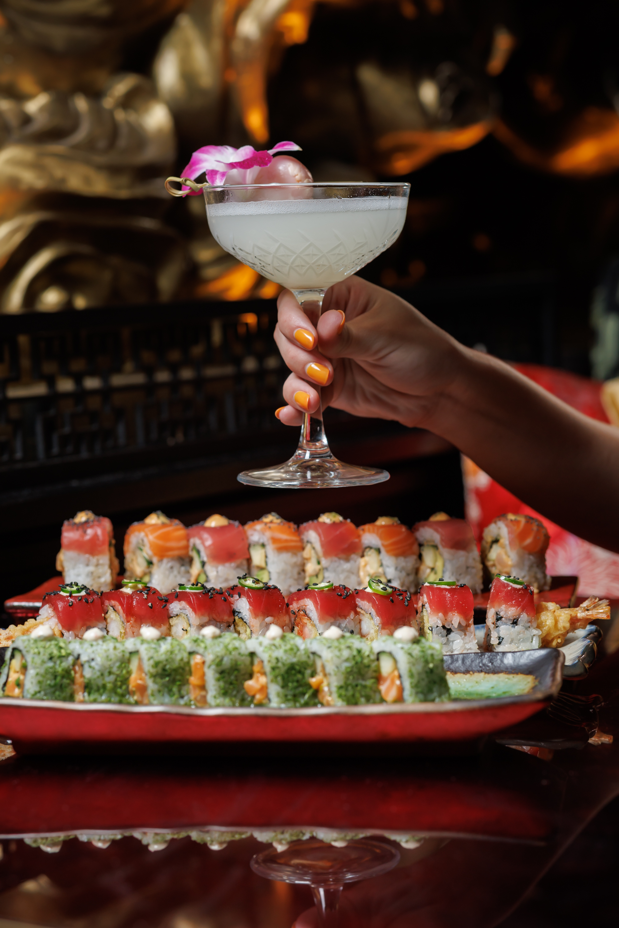 Discover signature sushi and cocktails at Mr. H in Boston’s Seaport District, featuring the Lychee M 