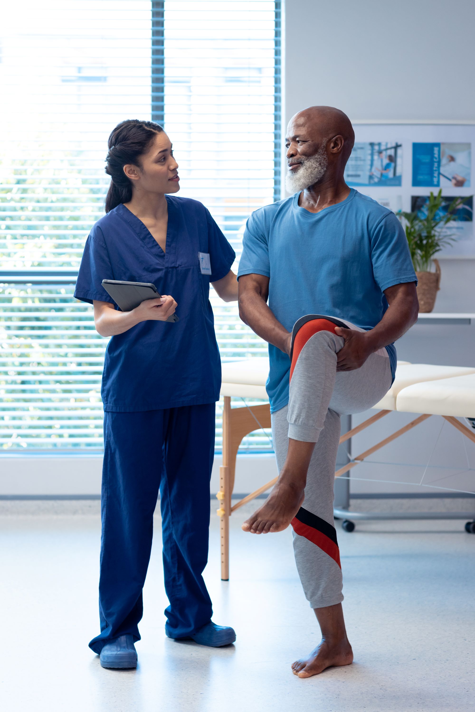 physical therapist helping a patient