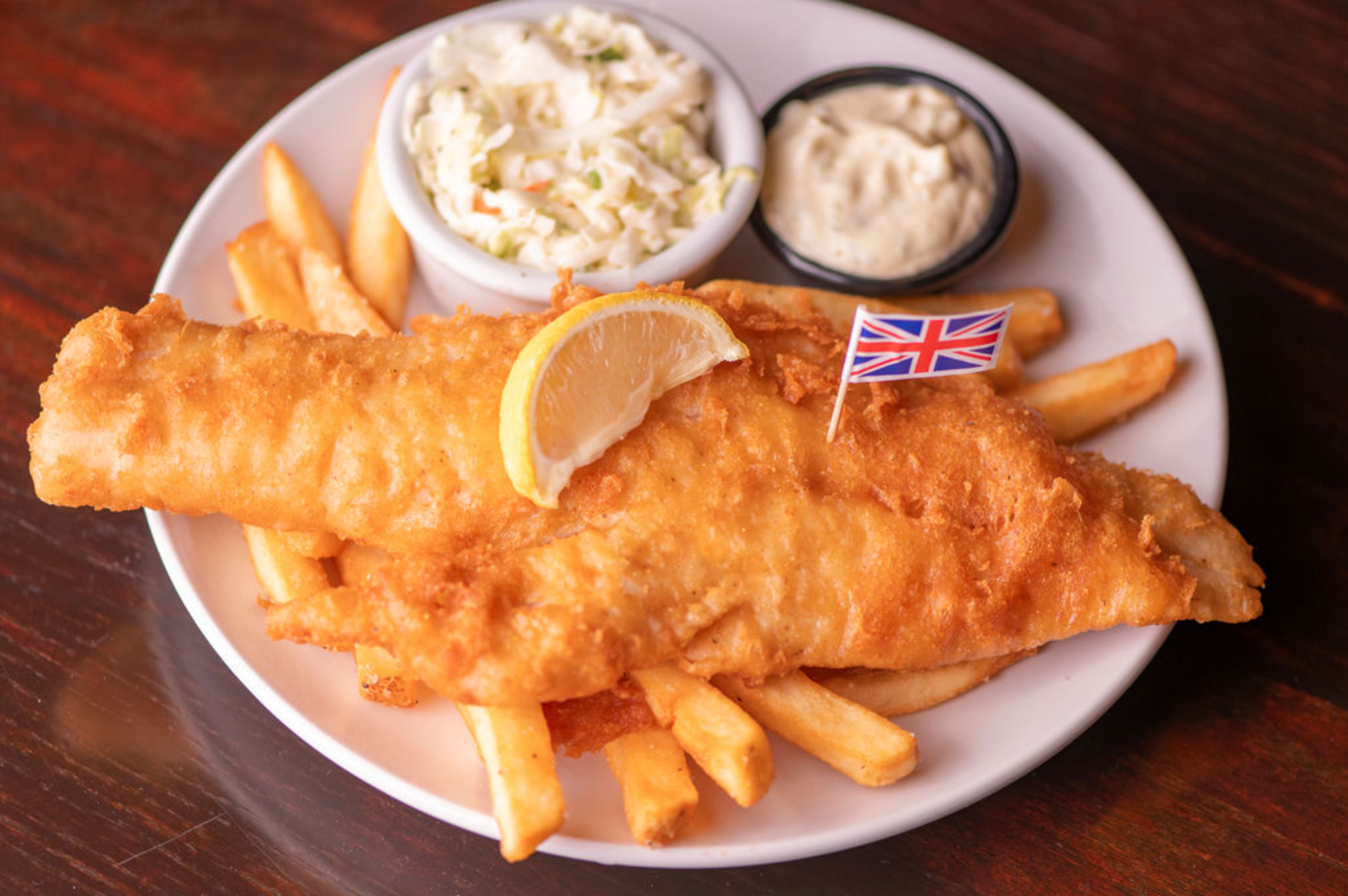 our award-winning, beer-battered haddock, house-made tartar sauce, & creamy coleslaw