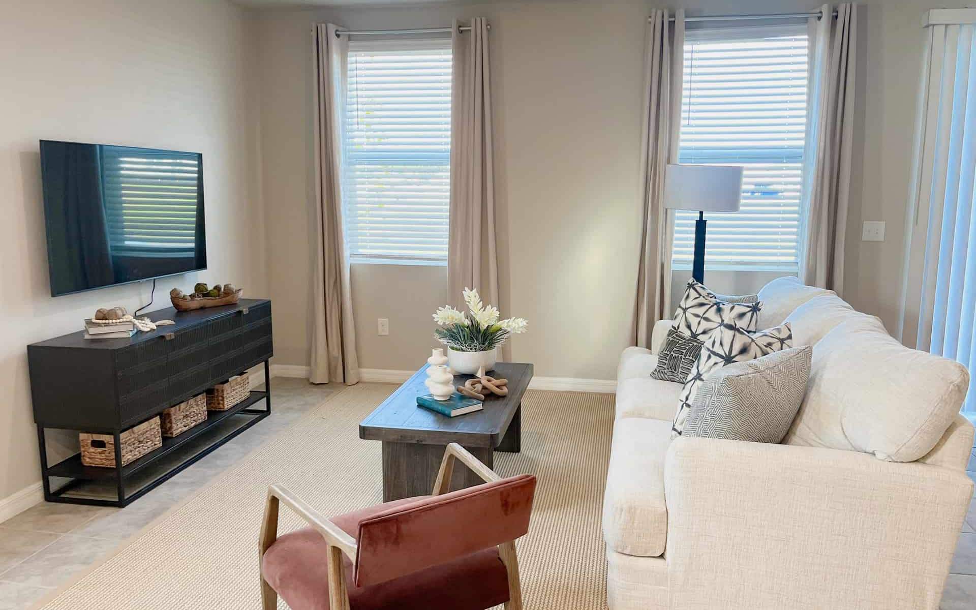 Cozy living room with large windows providing natural light.