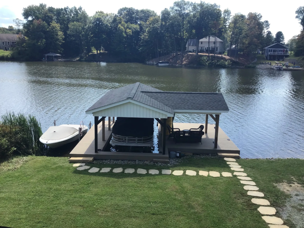 We built this covered boat dock for a homeowner at Lake Waynoka, Ohio. It not only has a covered are for the pontoon boat, but also has a sitting area on the right protected from the sun. Do you have an interesting backyard project that needs done this spring? Reach out and let's talk.