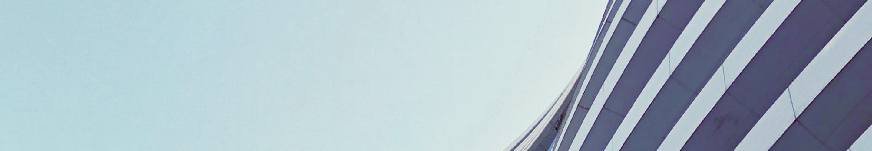 Close-up details of the curvature of a modern building.