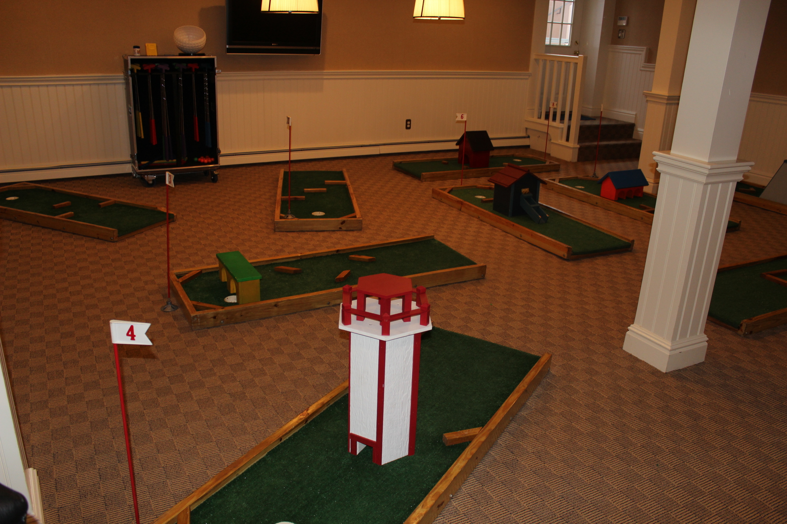 Mini Golf party rentals. We have the perfect mini golf course rental Long Island. Jump and Slide delivers backyard mini golf rentals across Long Island. Mini golf rental comes with score cards, golf clubs, pencils, and golf balls. Kids would love to have mini golf  course at their birthday party. Kids and adults will play on the golf course and try to sink the golf ball by avoiding the obstacles on this course. We deliver to all of Long Island including East Hampton for that perfect party rental or bounce house rental