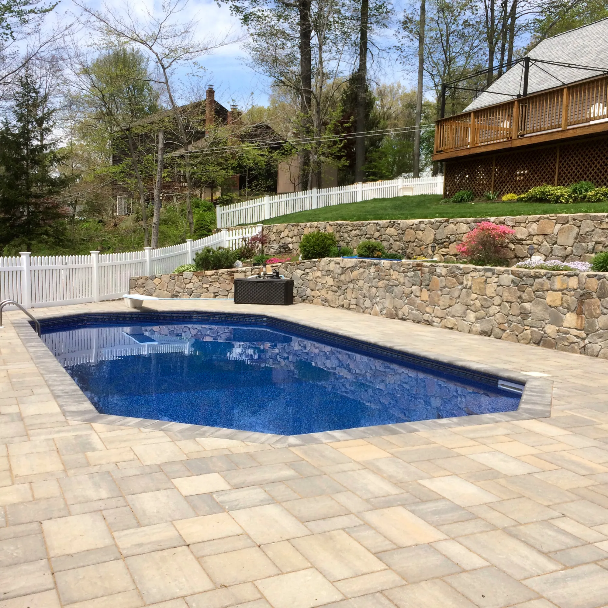 Paver pool deck with lounge area - Paver Pool Decks project by General Masonry LLC.