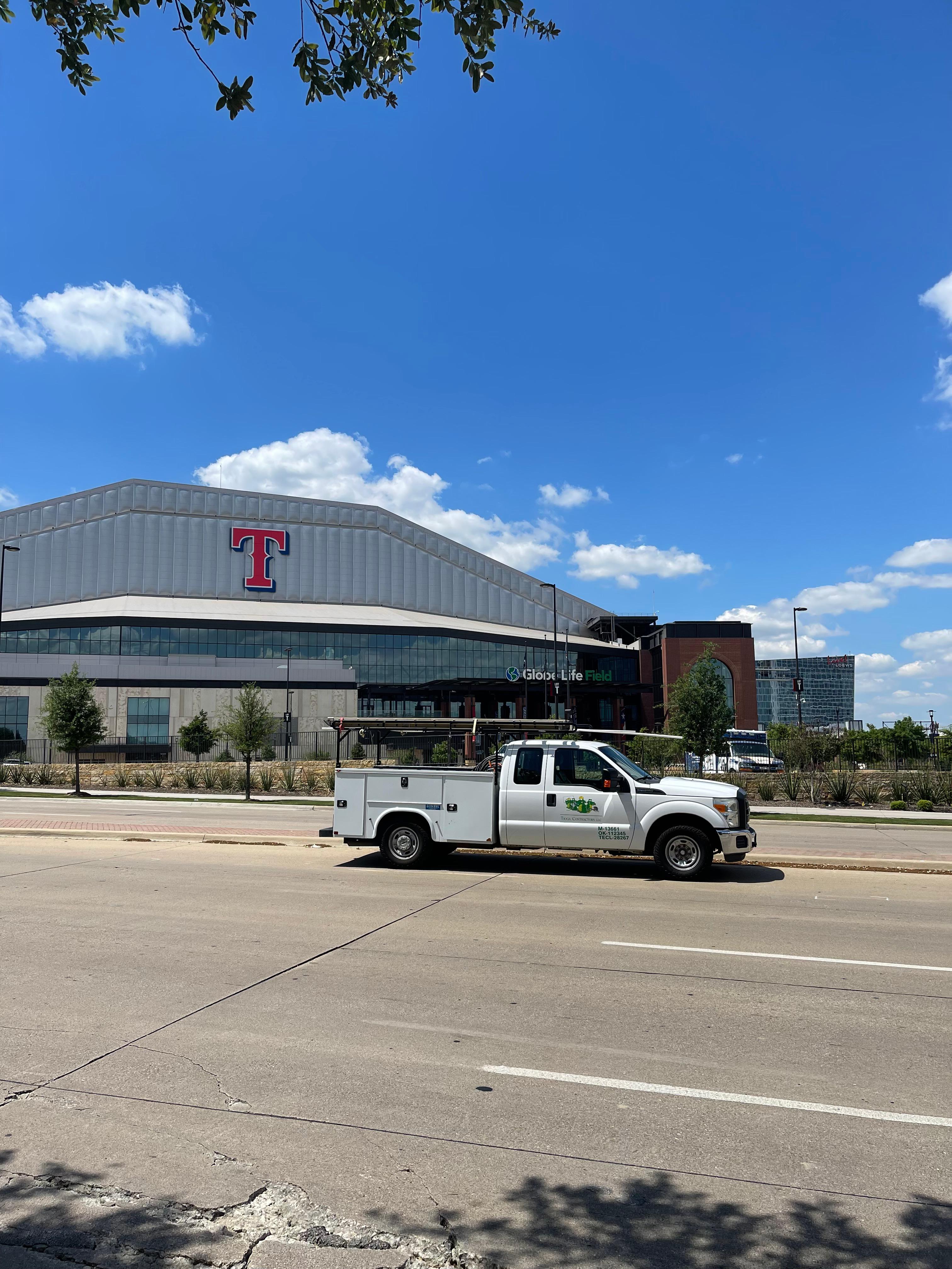 A Tioga Plumbing & Electric truck at The Texas Rangers Stadium in Arlington Texas.