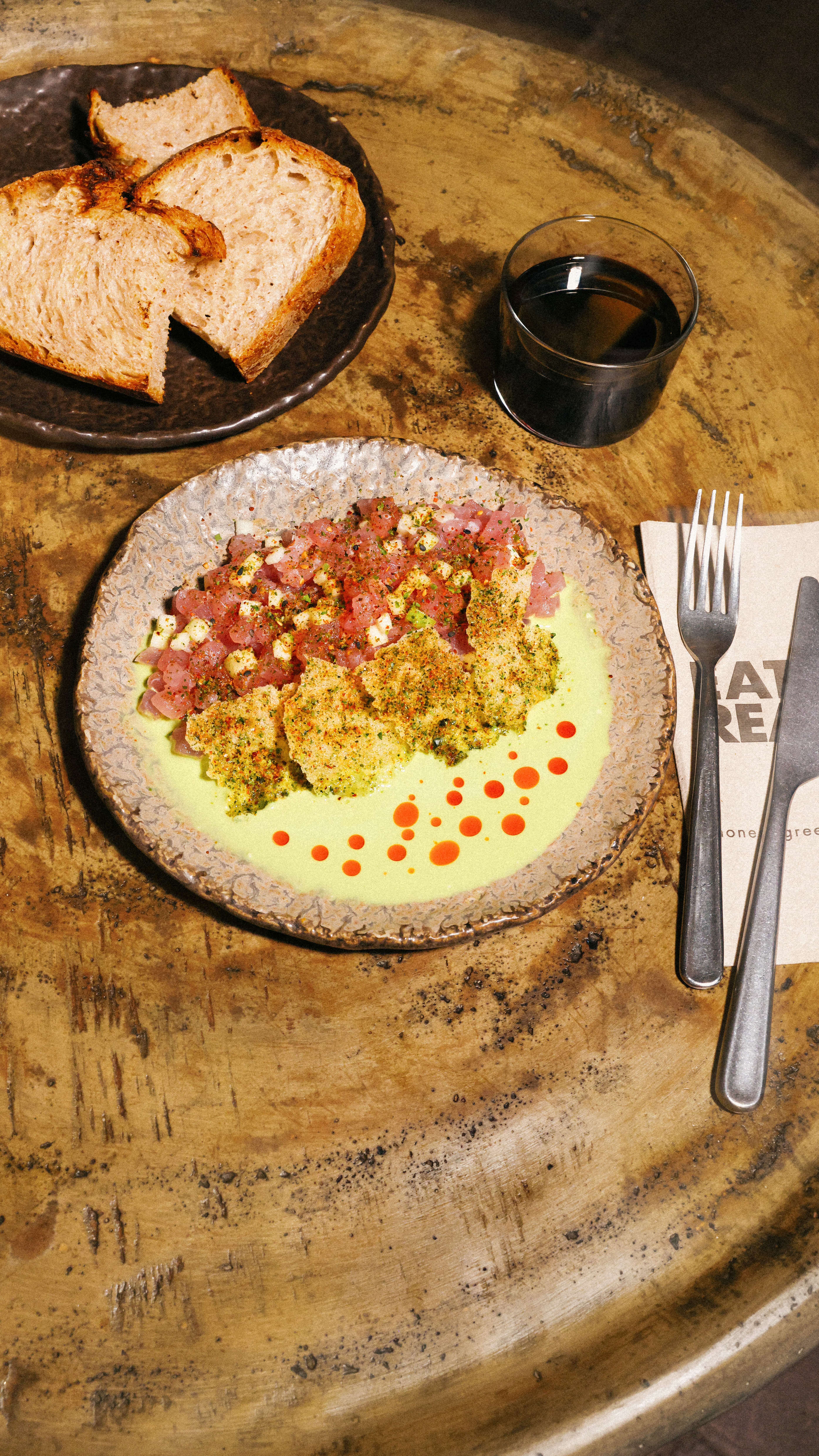 Crispy Rice Tuna Tartare with sourdough and a drink.