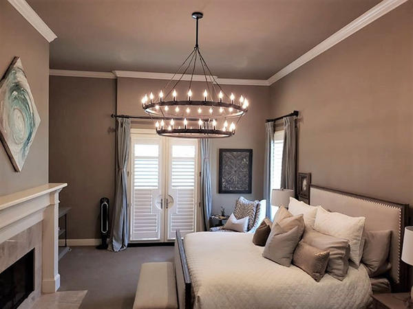 Shutters and drapery are the perfect pair to tie any bedroom together. Budget Blinds of Greenville, Terrell, Rockwall, and Forney have a vast array of options to choose from to complete your look.