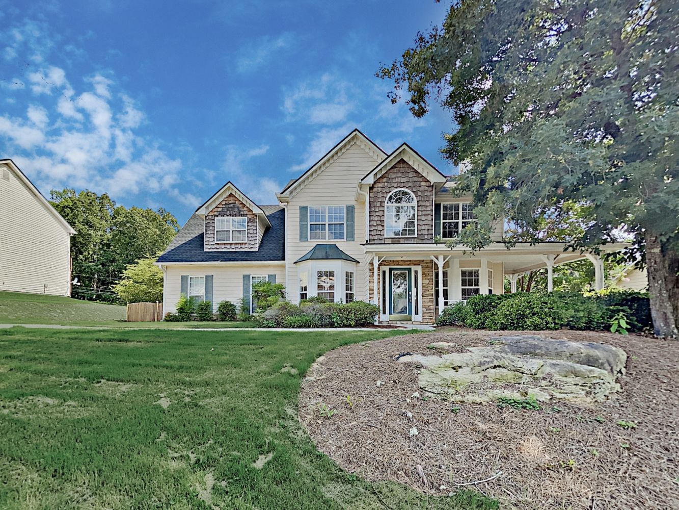 Gorgeous home with green landscaping at Invitation Homes Atlanta.