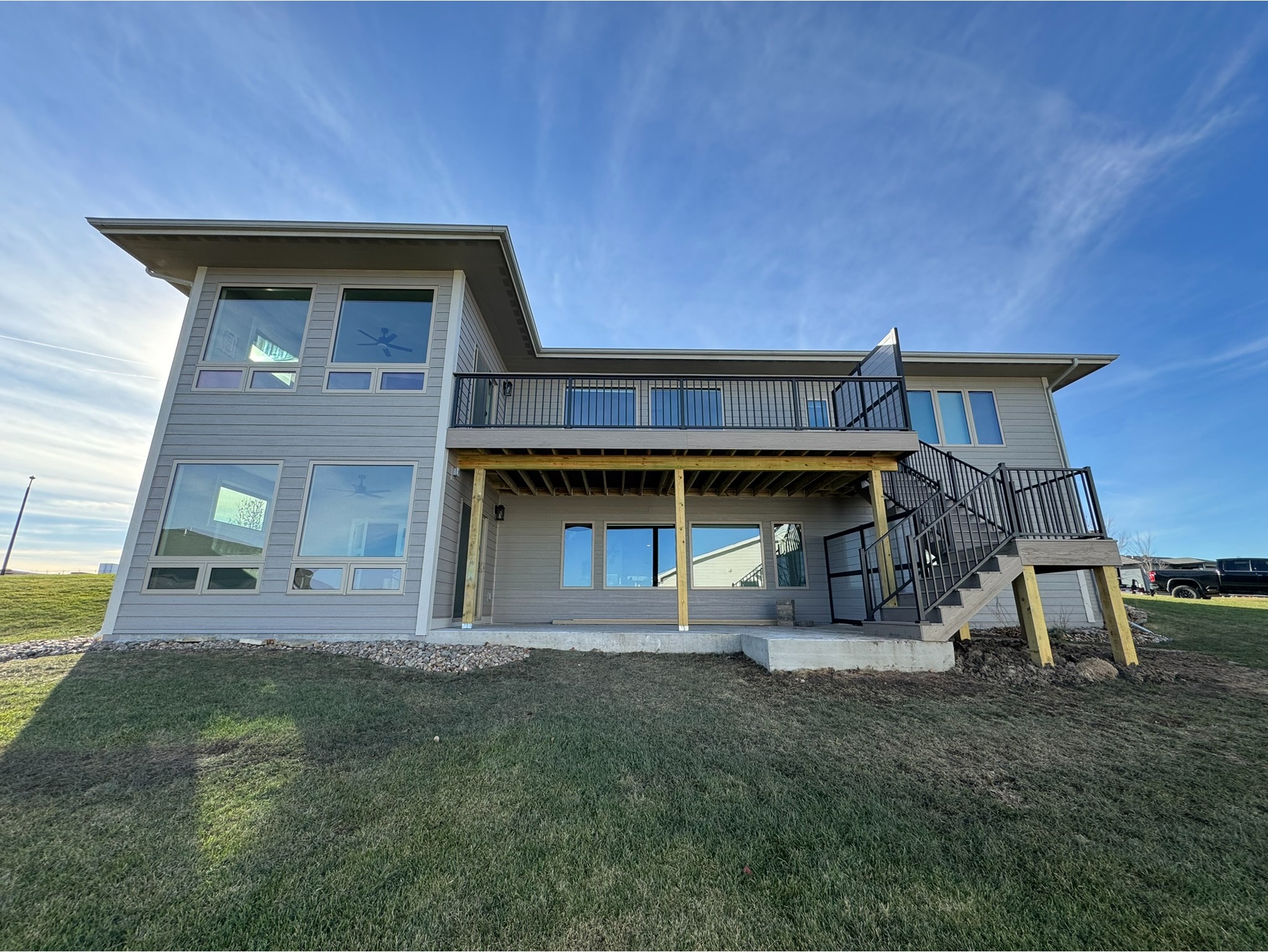Two Story Addition with custom Tanzite Stone Deck and Wrought Iron Sprial Staircase 