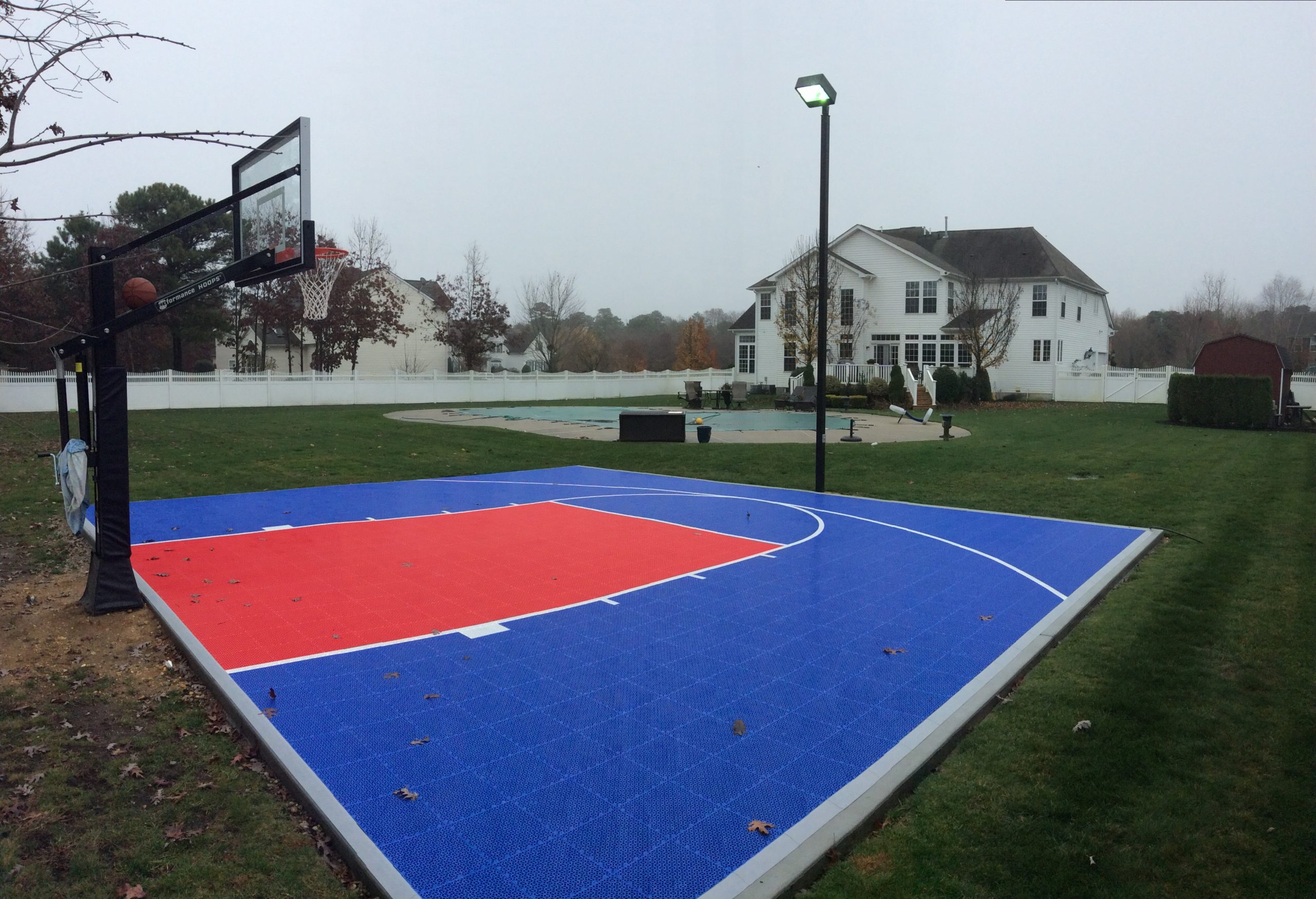 30′ x 30′ SnapSports DuraCourt Basketball Court Surface -Have a smaller space but still want the excitement of your own basketball court in your backyard, the SnapSports 30′ x 30′ is our most popular smaller court size.  This court features our DuraCourt outdoor surface with half court basketball lines.  Simply shooting around, a game of horse or pick up games with the kids, this basketball surface will provide a safe and attractive place to play.  With 19 colors  from which to choose your team can make this court their own!