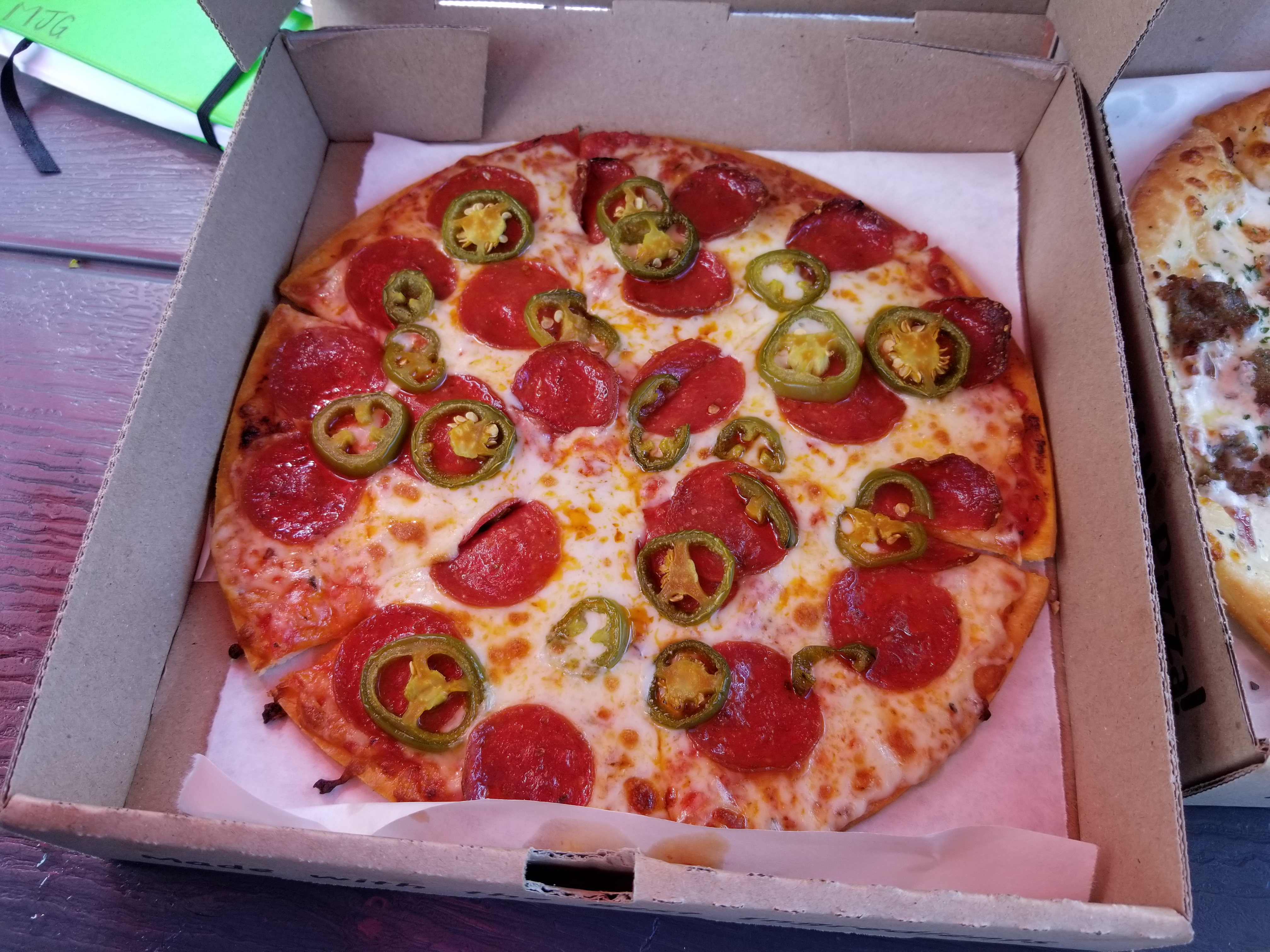 Try a delicious thin crust pepperoni and jalapeno pizza! One of our fan favorites, this pizza is packed with flavor and simmering with some heat!