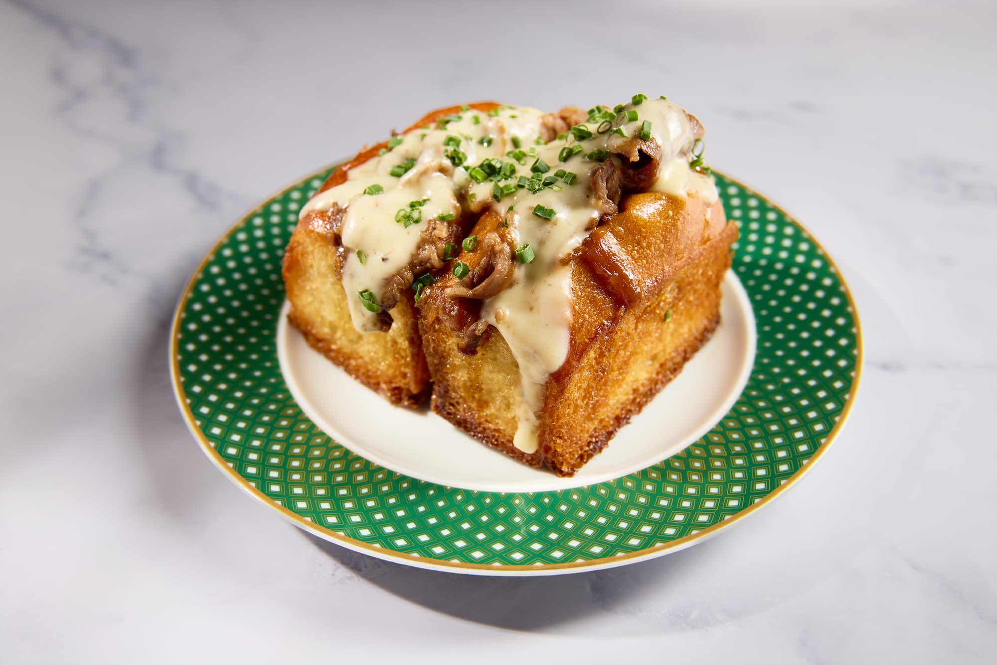 Gourmet wagyu cheesesteak sliders on toasted brioche at Carversteak NYC.