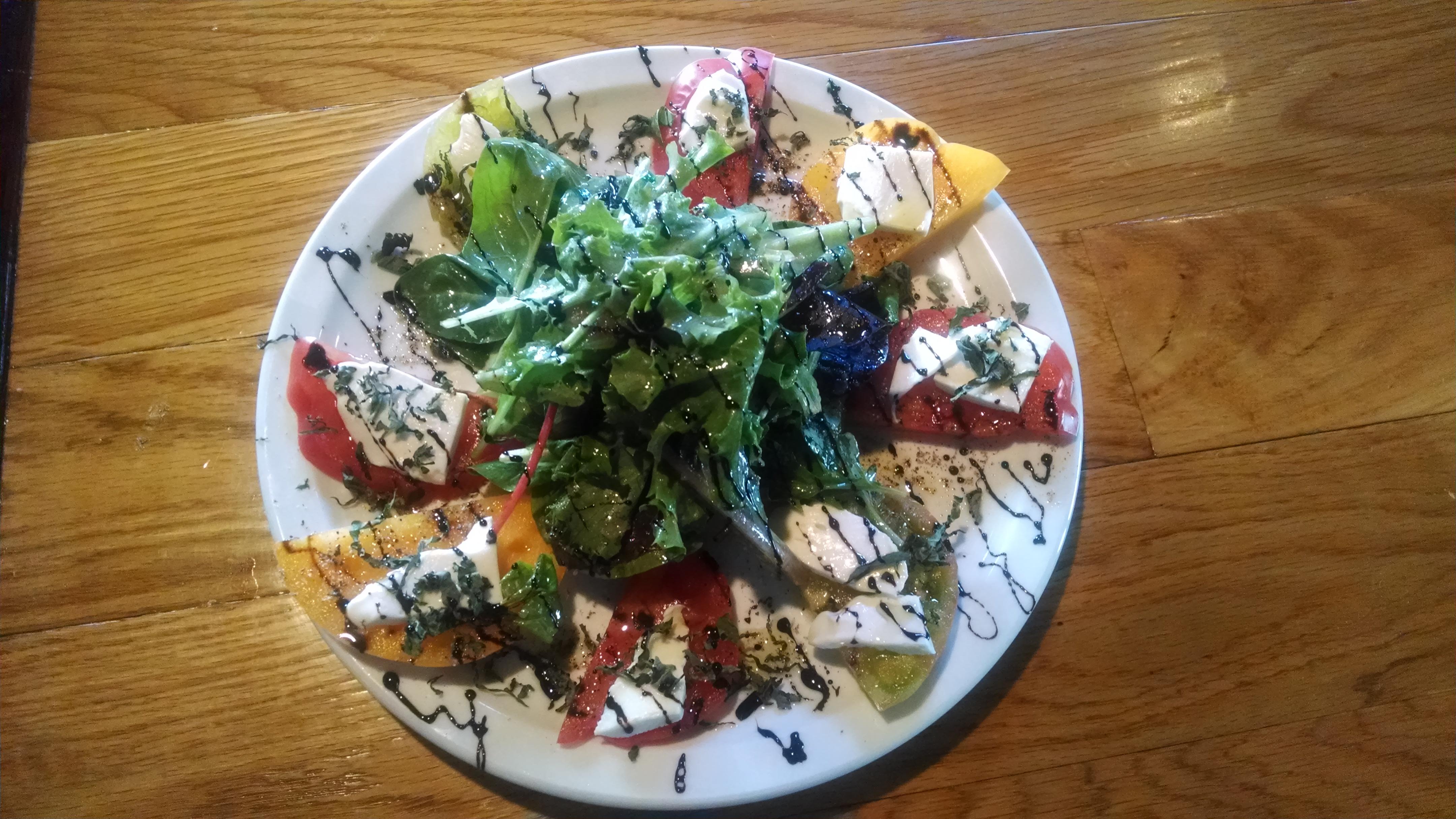 Sometimes we make our own home made mozzarella and caprese salads, when the heirloom tomatos are jus Bare Bones Cafe & Bar Portland (503)719-7128