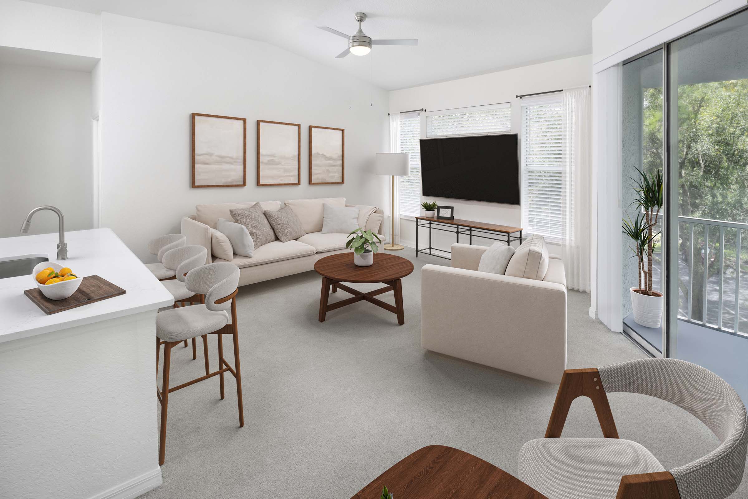 Open-concept living room with plush carpet and private balcony at Camden World Gateway apartments in Orlando, FL