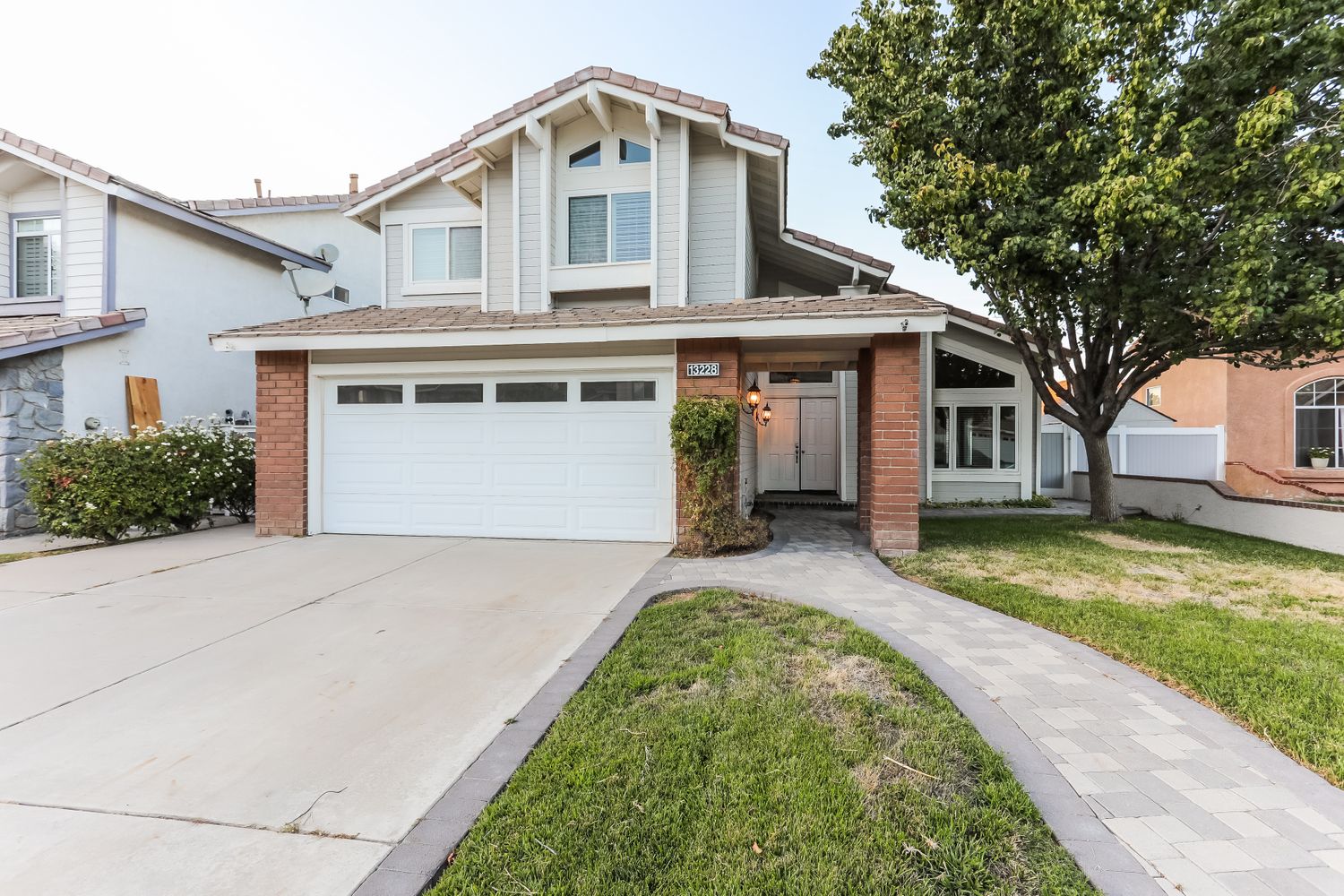 Front of house with two-car garage at Invitation Homes Pasadena.